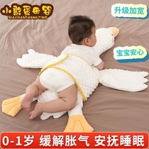 The baby sleeps on his stomach and the big white goose soothes the plane and relieves intestinal colic and flatulence. The baby's sleeping artifact