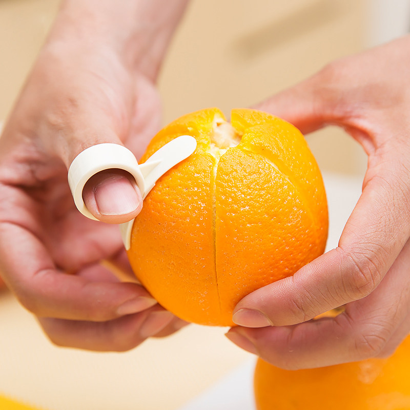 热销橙子削皮器_日本km橘子去皮器橙子剥皮器手指开橙器剥橙器水果