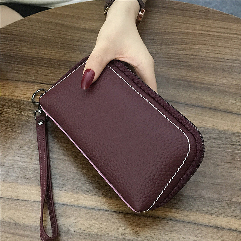 特价手拿包包女 手抓包 真皮