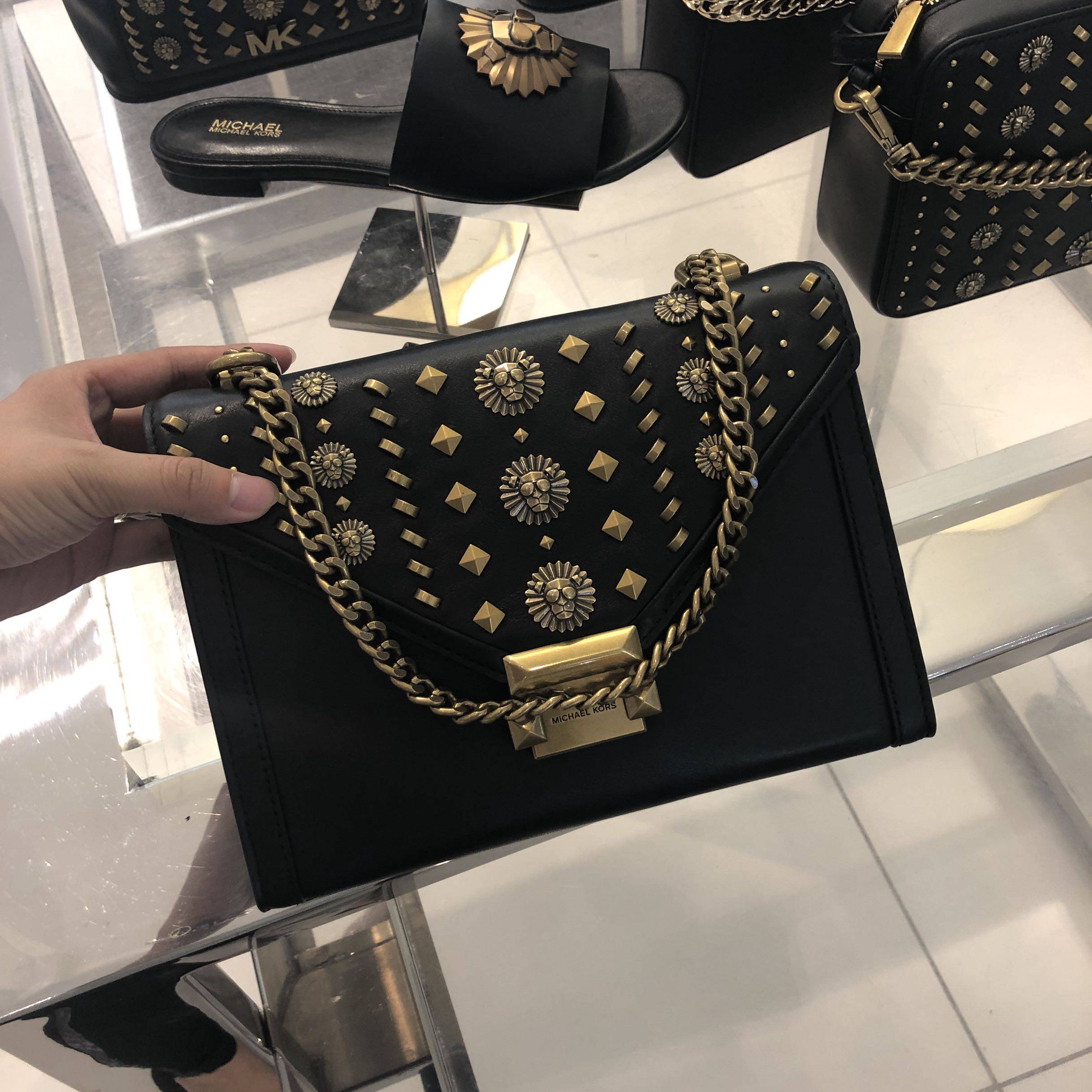 一折mk铆钉女包