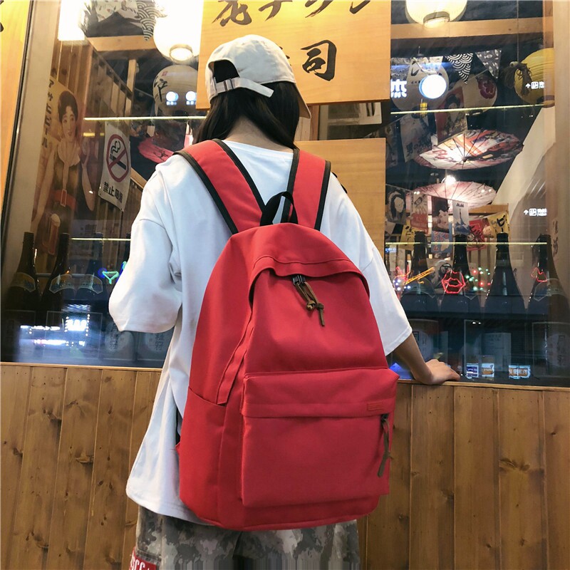 简约百搭双肩包红色大容量大学生时尚书包女韩Q版高中背包男旅行