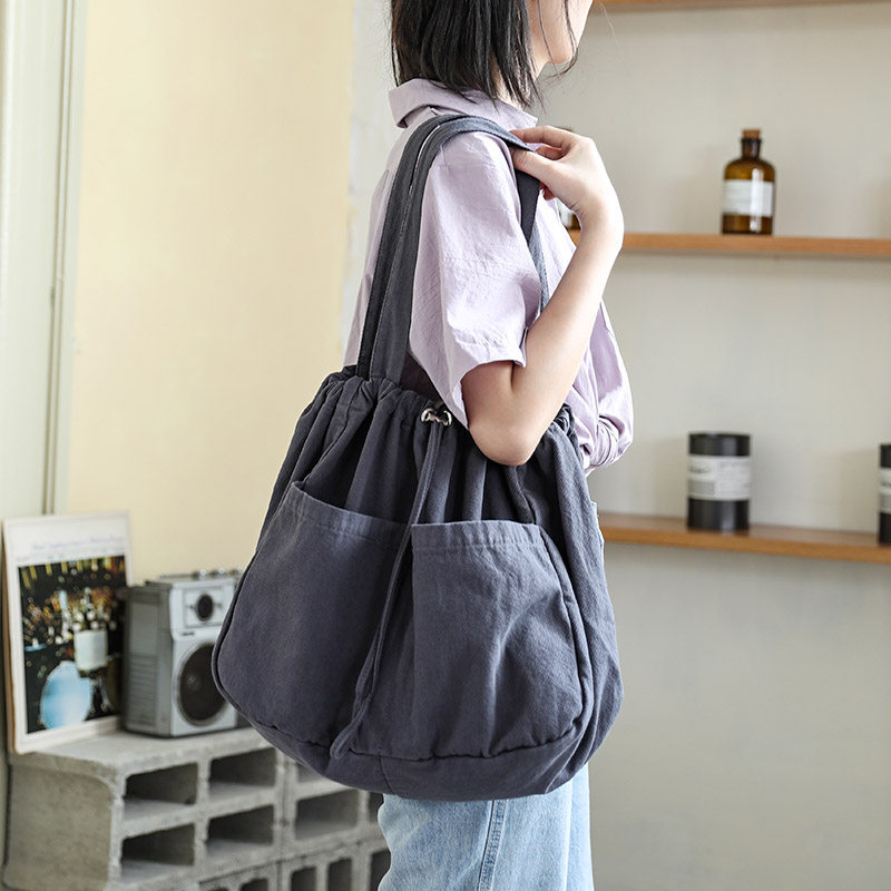 日系抽绳束口帆布包女简约百搭单肩帆布袋大容量学生Z手提布袋包