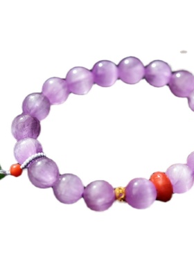 一斤钻戒诱人的紫光猫眼大珠 18k金天然原矿冰种猫眼紫锂辉手链