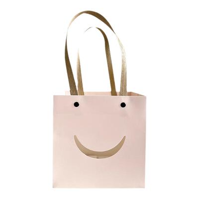芯苼迷你笑脸鲜花手提袋