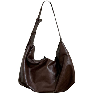 软皮大容量黑色饺子包包女2025新款复古通勤休闲单肩斜挎托特包