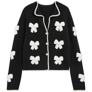 bebe冬季女士含羊毛羊驼毛蝴蝶结装饰撞边宽松针织外套开衫430602