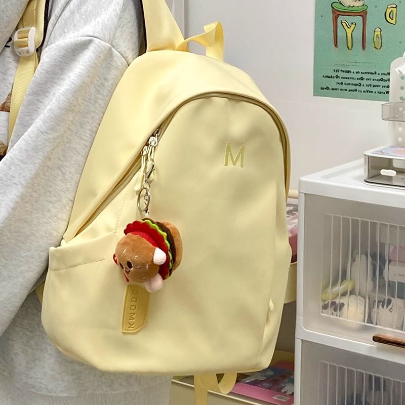 书包女初中奶油系高颜值黄高中学生大容量双肩包女简约大学生背包