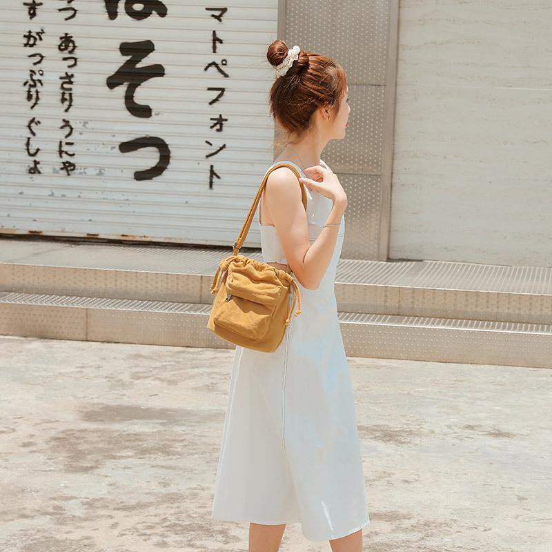 新品 复古单肩帆布包女斜挎纯色小包包抽带束口2025新款水桶包文