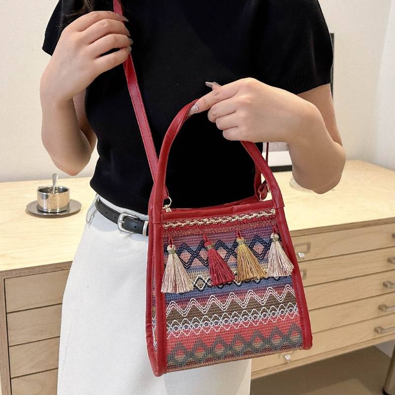 新品 高级感2024新款包包女斜跨民族风小众编织水桶包单肩百搭流