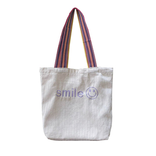 小白兔几 韩国ins流苏彩肩带刺绣笑脸学生单肩包文艺森系帆布女包