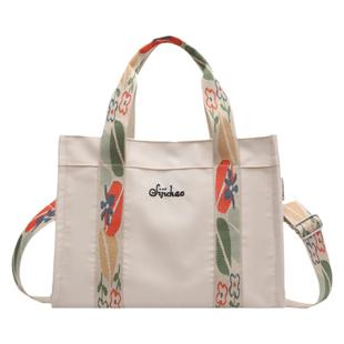 帆布手提包包女2025新款休闲轻便大容量通勤包时尚宽带单肩斜挎包