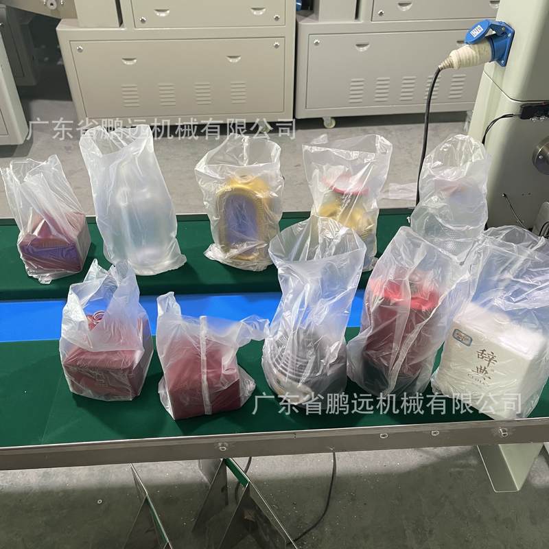 玻璃酒瓶套袋机玻璃白酒瓶包装机玻璃空瓶自动套袋机单边封口