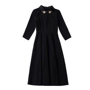 春小黑裙2025秋冬新款气质修身a字裙娃娃领中长款长袖黑色连衣裙