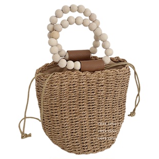 cosyzing包包夏季新款海边沙滩草编包木珠手提圆筒水桶包斜跨小包