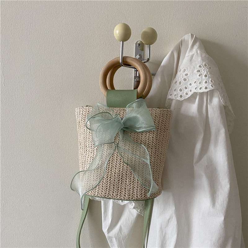 新品 田园风草编包包女2022新款潮时尚手提水桶包小众单肩斜挎包