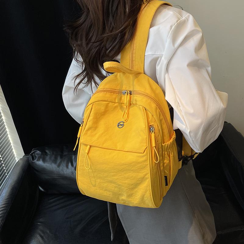 双肩包超轻2025新款高级感小众尼龙帆布上班通勤旅行背包小型轻便