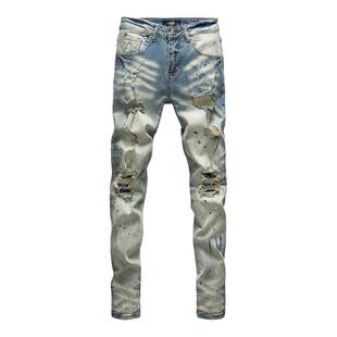 高端轻奢泼墨涂鸦破洞补丁牛仔裤男款痞帅水洗做旧修身显瘦长裤子