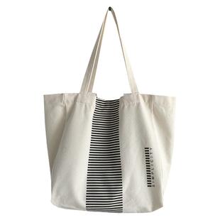 大容量通勤单肩帆布包包女2026新款大学生上课包旅行手提袋托特包