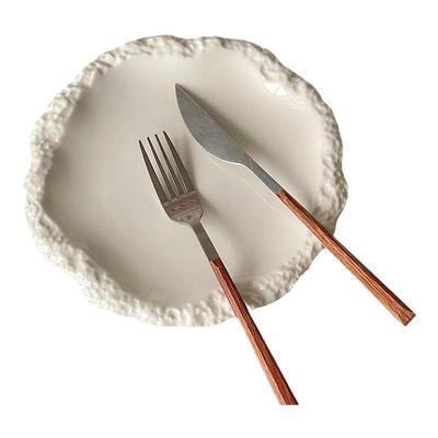 半刻陶瓷圆形岩石纹平盘