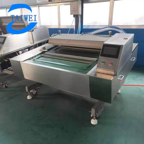 大型倾斜麻辣手剥笋真空封口机  清水藕片连续滚动式真空包装机