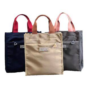 时尚新款纯色女士手提包上班通勤轻便手提袋非帆布老人外出手拎袋