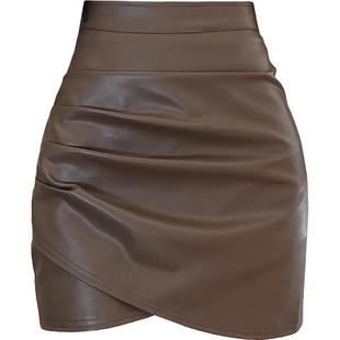 白色pu皮裙子半身裙女秋冬季2025新款高腰显瘦不规则褶皱包臀短裙