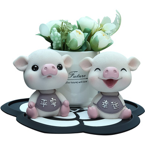 车内饰品摆件车载个性创意可爱摇头小猪男女高档汽车装饰用品大全