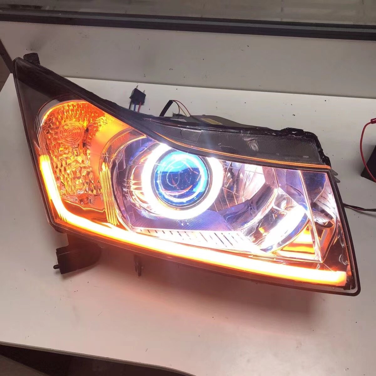 09-14科鲁兹大灯led透镜双光改装天使恶魔眼流水转向日行灯总成