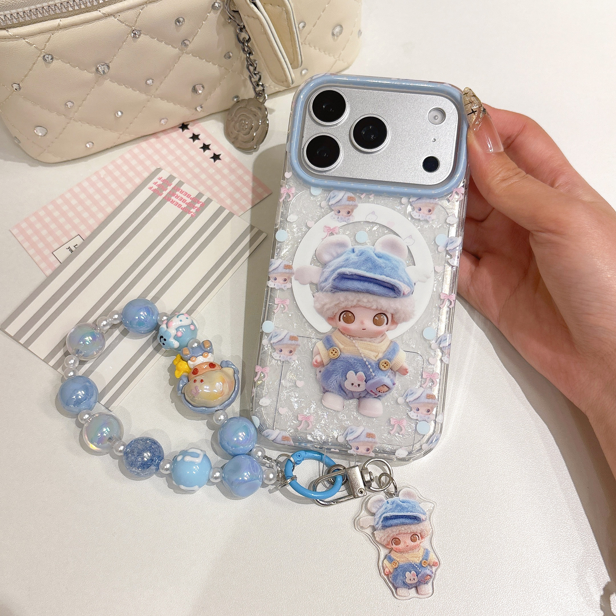 卡通小飞象Dimoo贝壳纹磁吸支架适用iPhone18ProMax手机壳女款苹果17Pro带手链16/15全包防摔保护壳