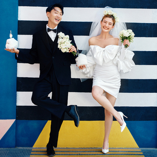 新款照相馆主题服装旅拍婚纱摄影情侣写真街拍蝴蝶结白短裙拍照礼