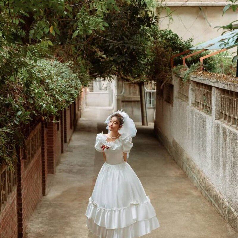 2023新款影楼主题服装轻复古缎面蝴蝶结婚纱外景旅拍摄影写真礼服