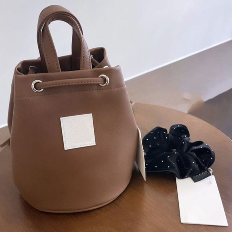 QJBY双肩抽绳水桶包时尚原创ins