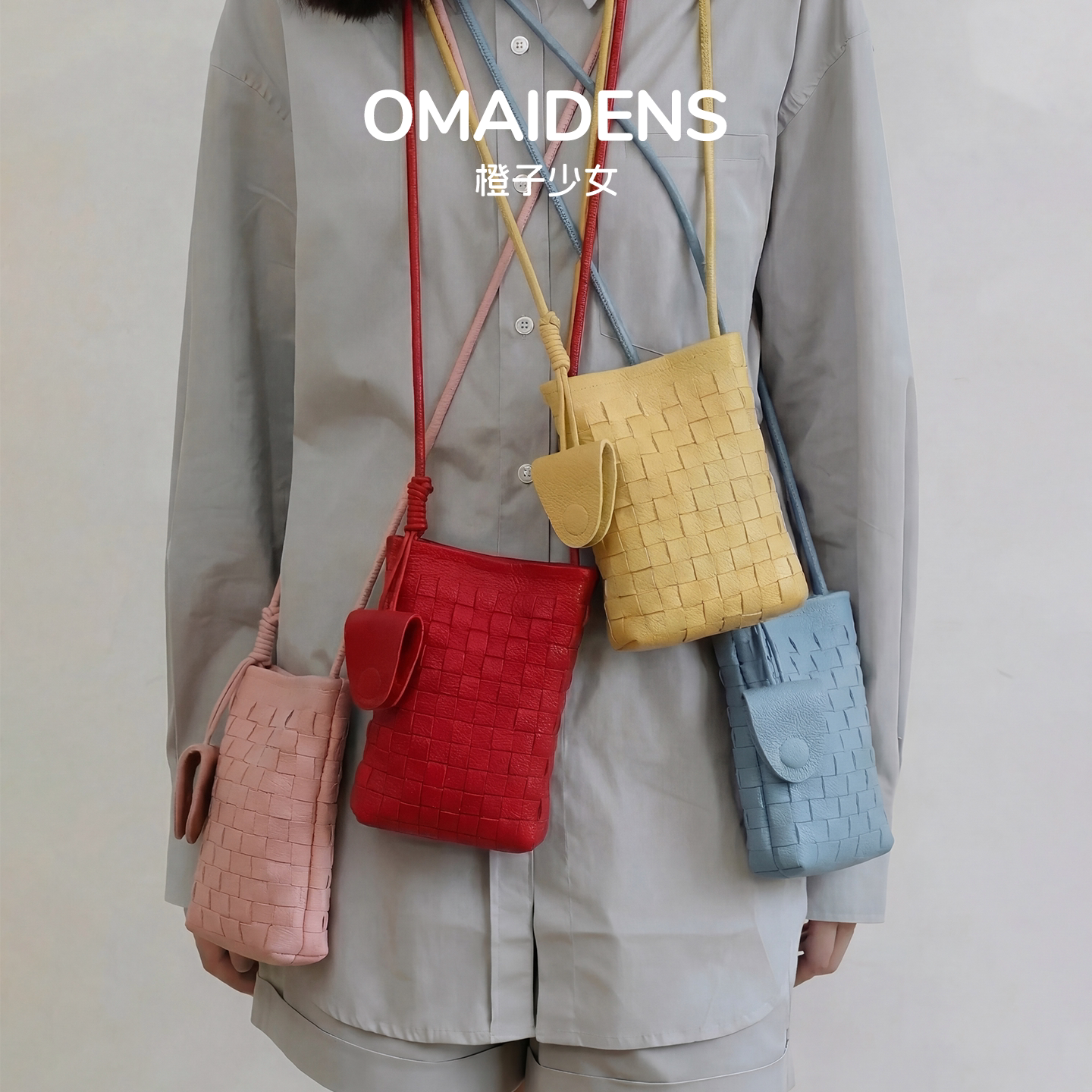 橙子少女红色水桶包高级感斜挎手机包小众设计感编织包韩系零钱包