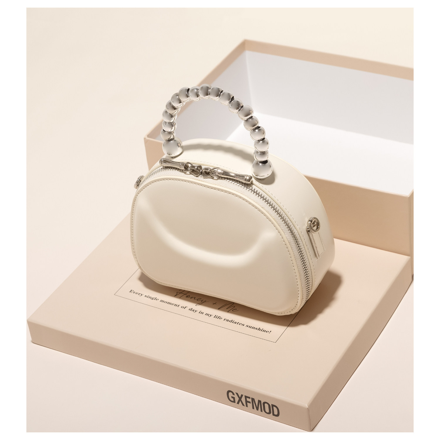 GXFMOD时尚牛皮马鞍包女精致串珠手提包2024新款ins单肩斜挎小包