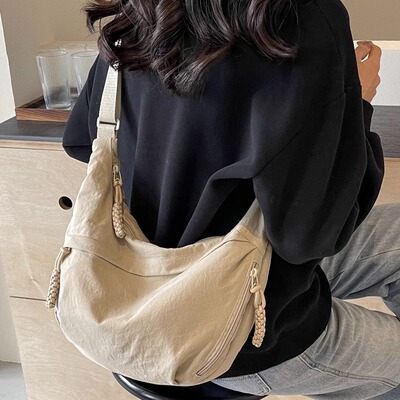 包包女2025新款潮流斜挎包女大容量帆布通勤单肩包运动百搭饺子包