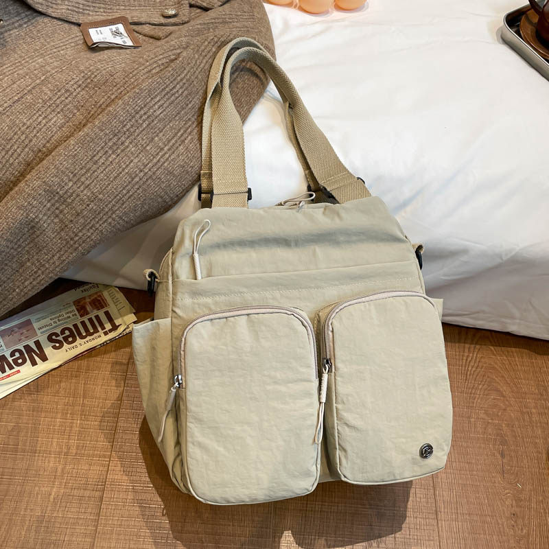 日系工装风多口袋斜挎包女轻便防水尼龙布包休闲通勤手提单肩包