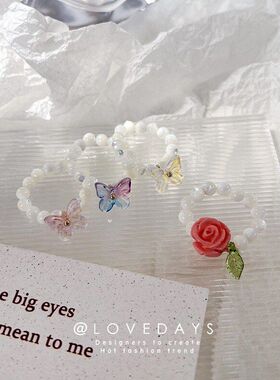 个性设计弹力玫瑰花戒指猫眼石花朵炫彩蝴蝶戒指温柔串珠叠戴指环