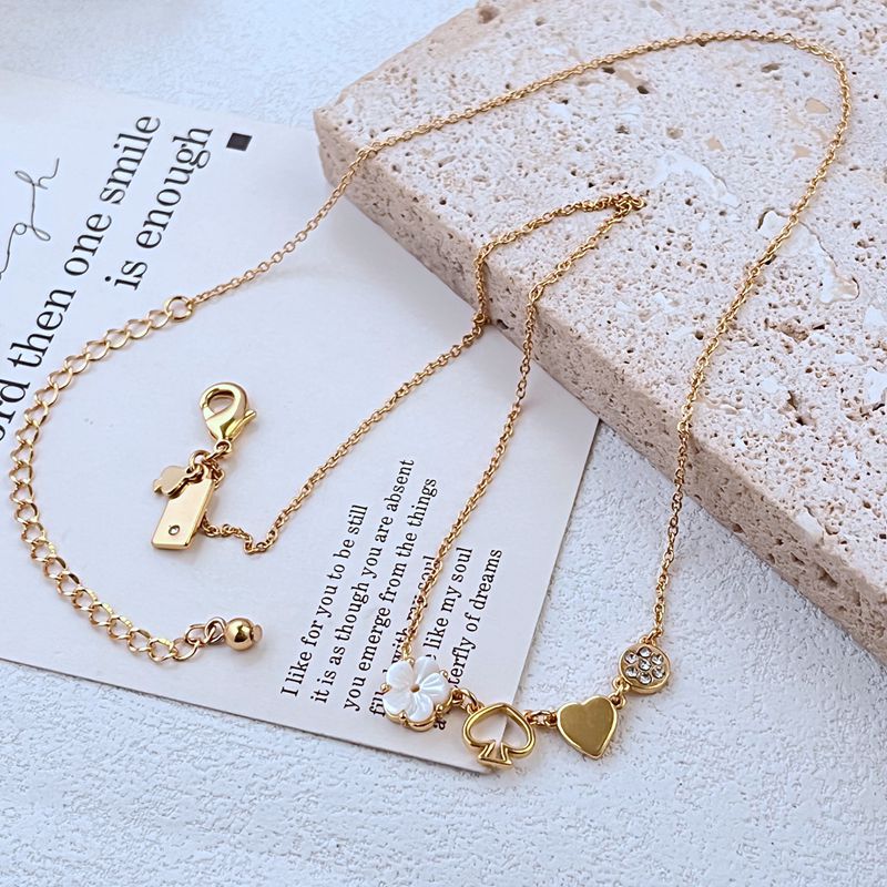 新款时尚轻奢通勤小众甜美花朵 镂空黑桃 爱心 圆形多坠金属项链