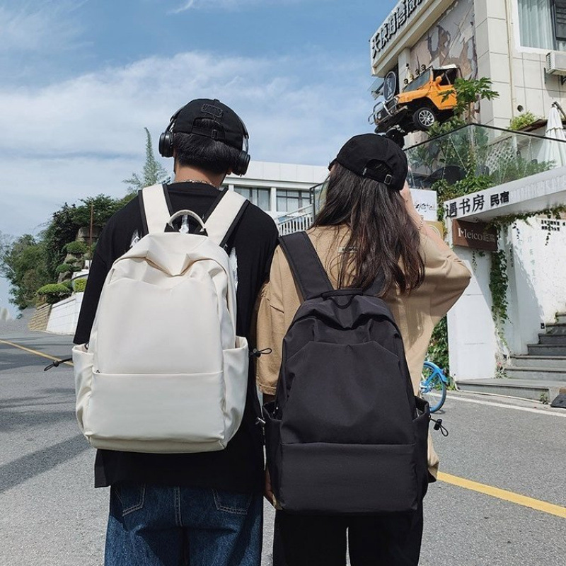 书包女纯色简约大容量小众新款背包男大学生旅行轻便双肩包