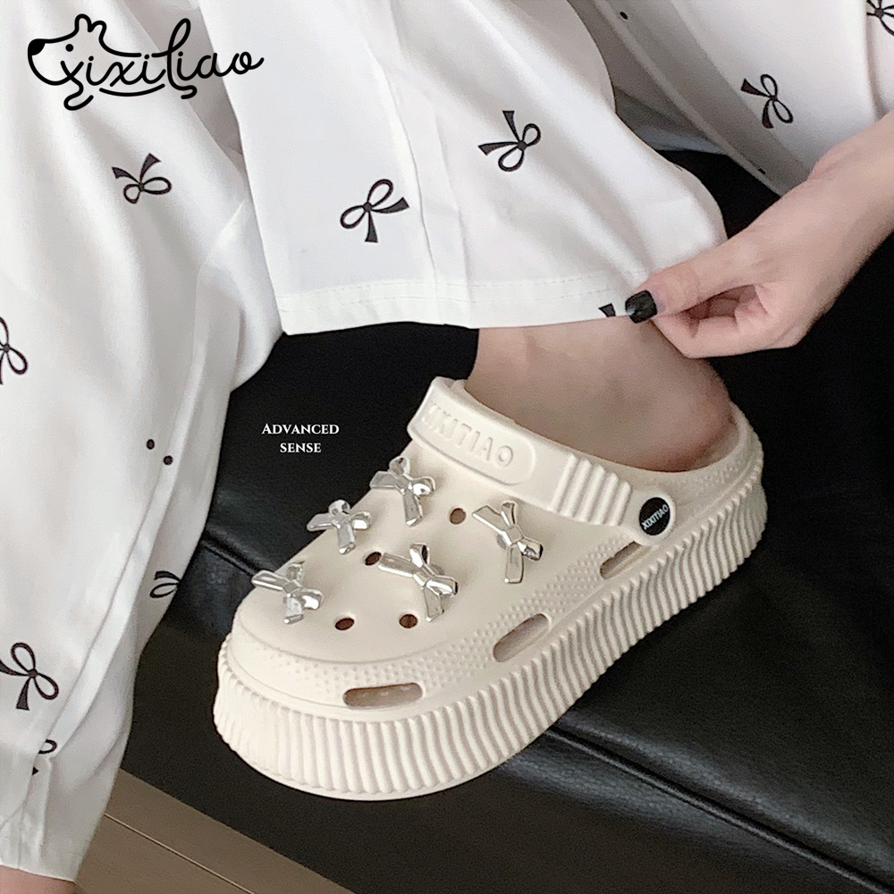 细细条银色蝴蝶结厚底洞洞鞋