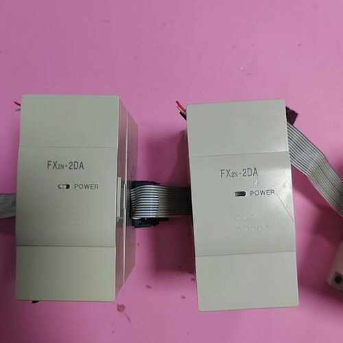 三菱FX2N2DA拆机如下图实物拍摄功能包好盖板议价
