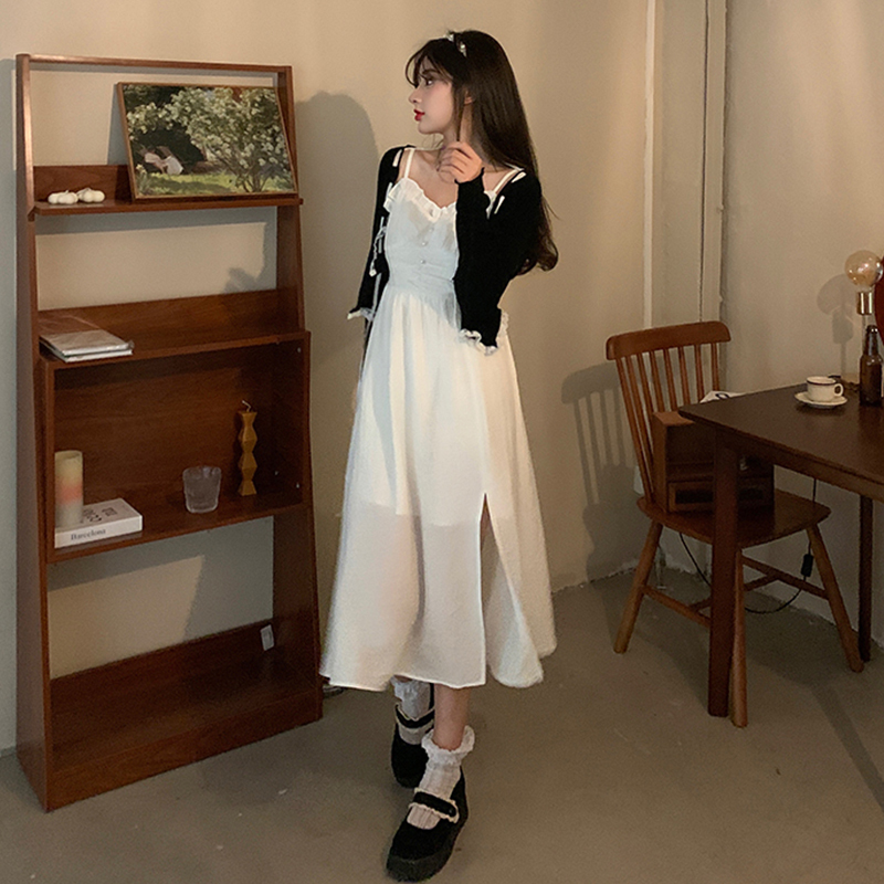 Two piece black cardigan and white suspender dress