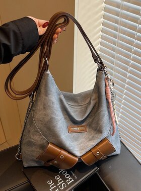 2026春季新款带挂件黑茶色牛仔蓝PU2025年春季车缝线均双肩背包