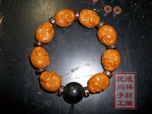 橄榄核雕招财弥勒 配牦牛角佛头
