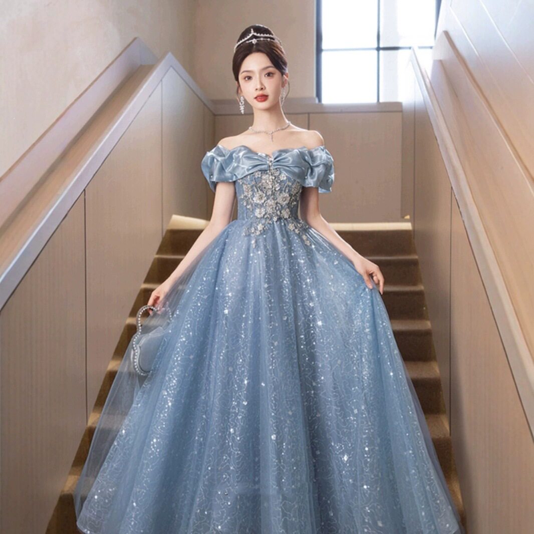 一字肩蓝色晚礼服裙2026新款聚会绝美轻奢小众主持人走秀宴会礼服