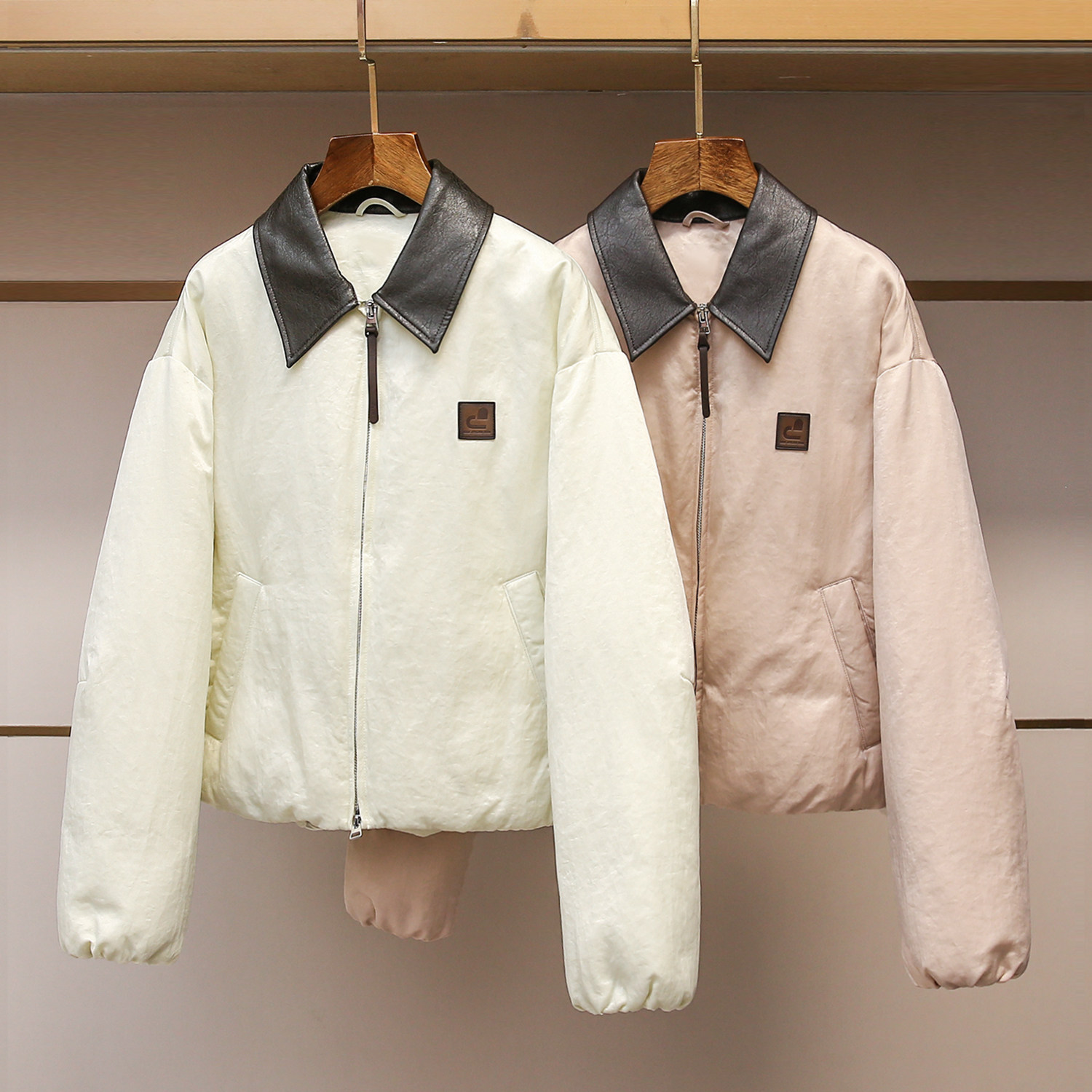 深圳南油高端女装2025冬季新款设计感拼接环保皮翻领羽绒服外套女