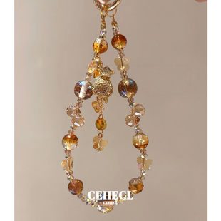 金色小福袋手机链吸金招财爆闪手机挂绳小众时尚包挂饰ccd相机链