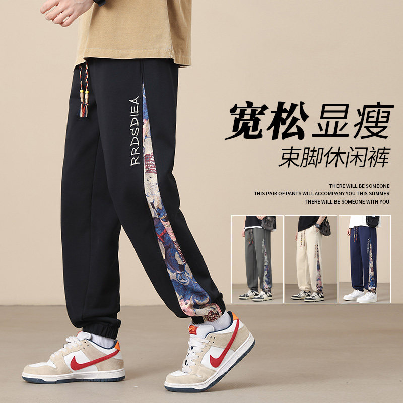 K7930P32卡通拼接裤子宽松束脚时尚休闲裤男潮牌青少年运动长裤图片