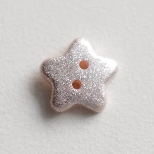 闪亮银色五角星背面浅粉色纽扣