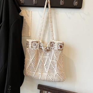 全球森系肩i族ns民度风针织包包女镂空单手提袋海边沙滩假休闲托